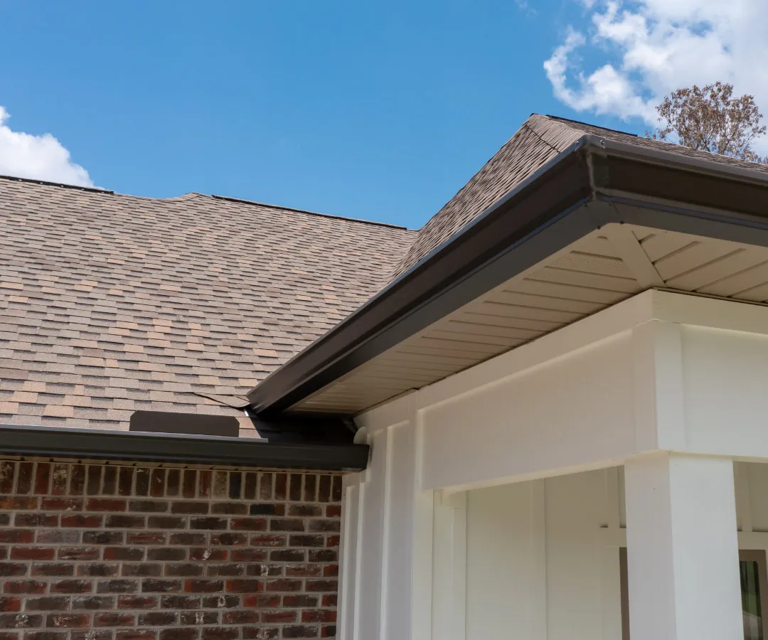 dark brown k-style gutters with brown shingle roof